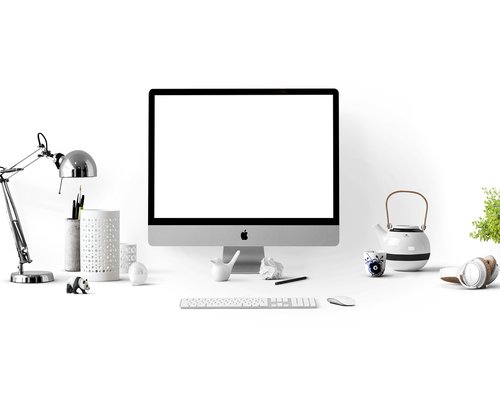 Clean minimal desk lit from the side by gentle natural sunlight